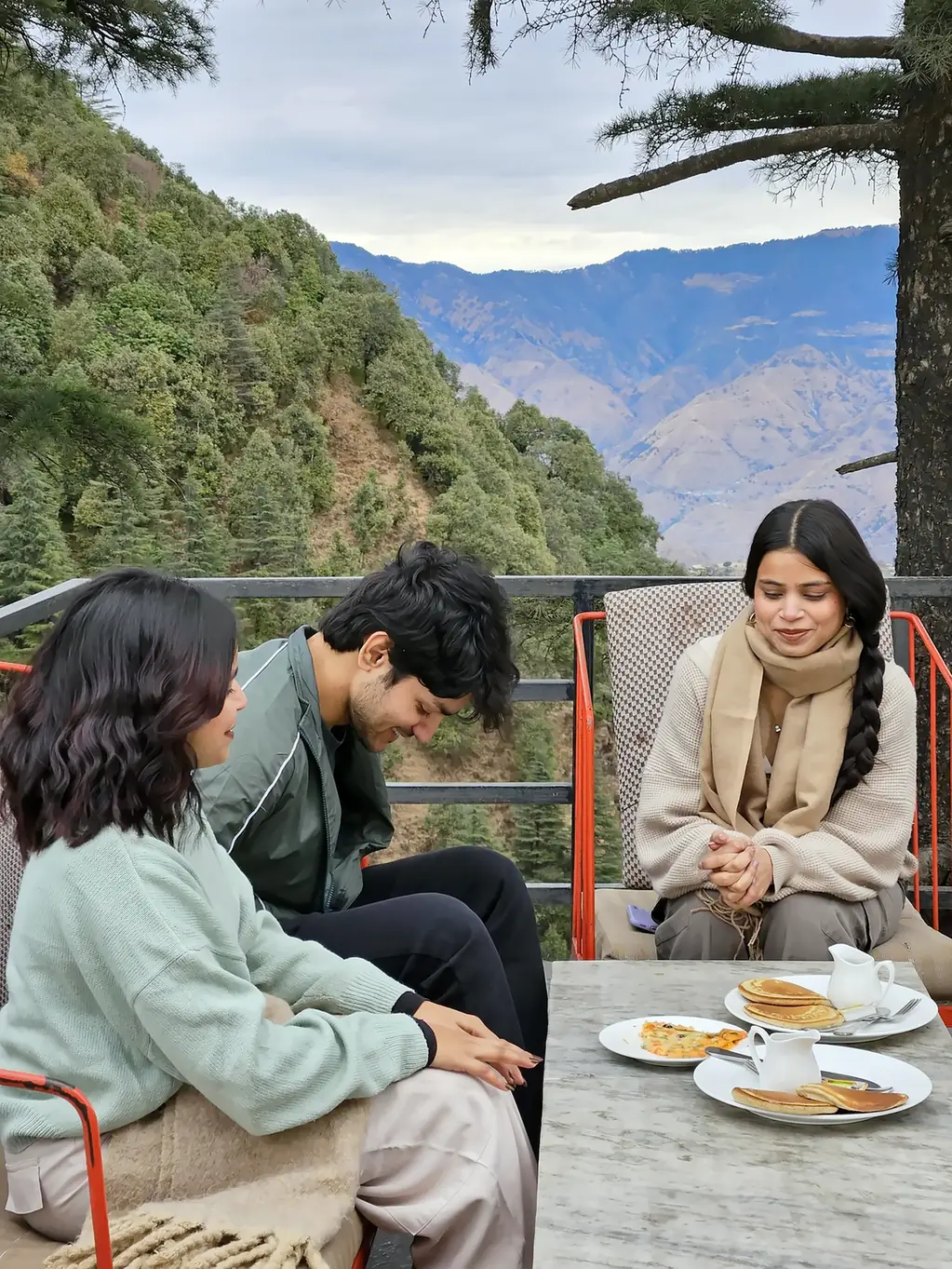 Guests over tea on the terrace above the valley, The Coverpage Boutique Stays, Mussoorie