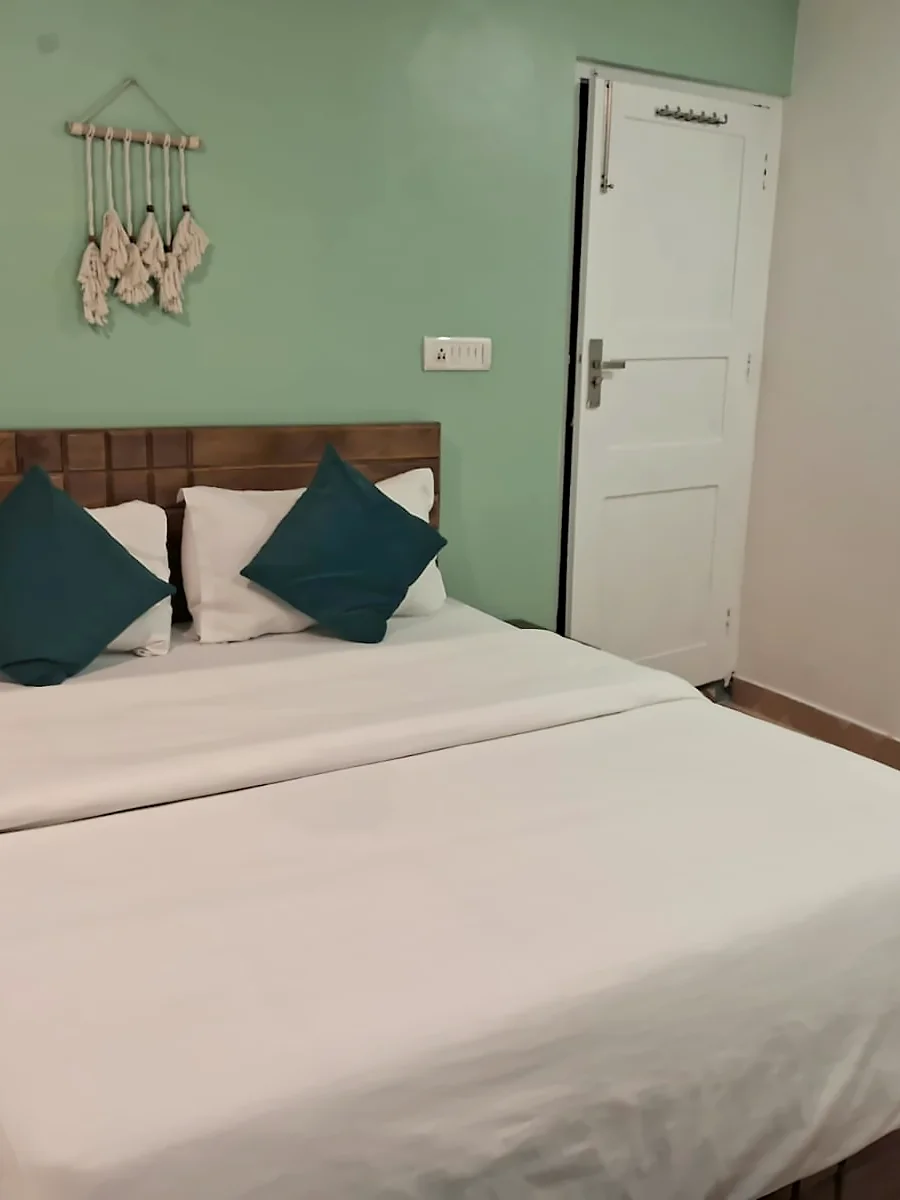 Bed and wall art, Fireside Retreat room, The Coverpage Boutique Stays, Mussoorie