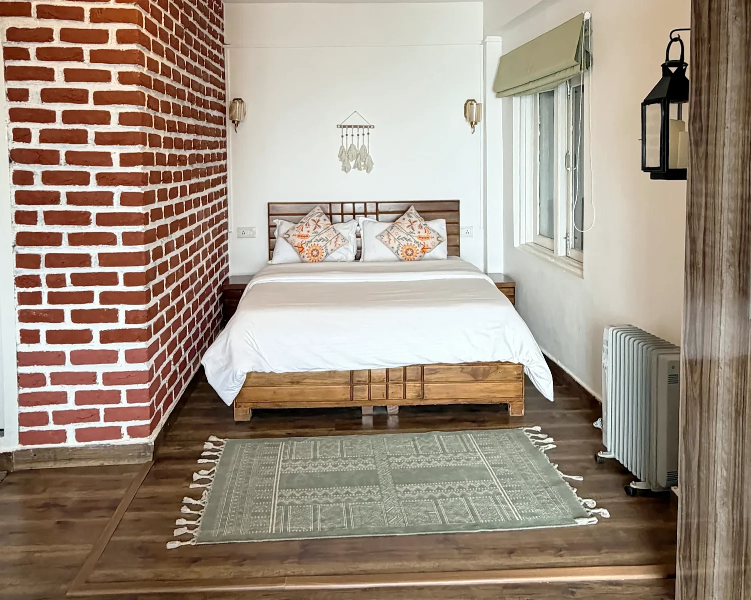 The Nest bedroom with a brick feature wall